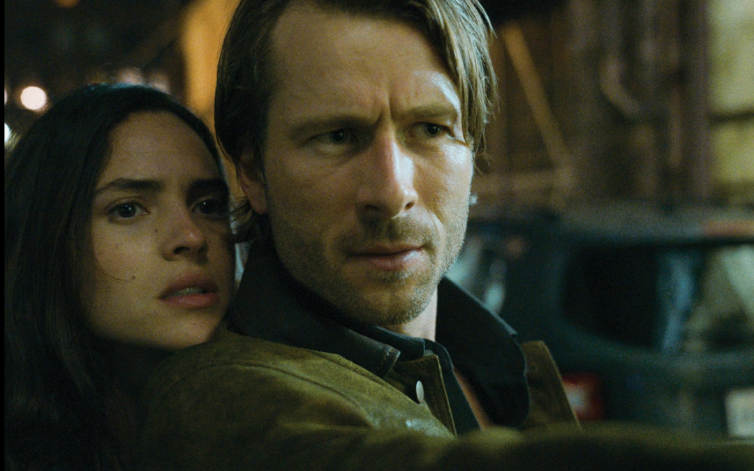 Netflix Drops Sneak Peek of Action-Packed Rom-Com “Hit Man” Starring Adria Arjona and Glen Powell
